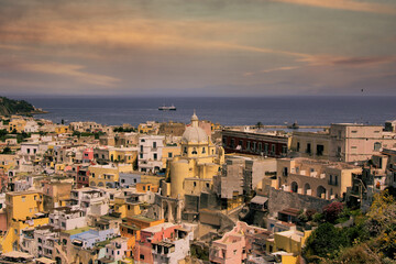 Procida island, Naples, Italy, colorful houses in Marina di Corricella harbour in sunset light