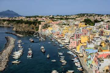 Fototapeta na wymiar Procida island, Naples, Italy, colorful houses in Marina di Corricella harbour on sunrise light