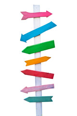 Colorful wooden direction arrow signs on a wooden pole