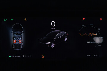 Close up shot electric car dashboard view during fast charging when parked at power charging...
