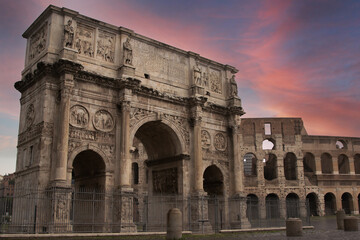 Rome, Italy at the Arch of Constantine and the Colosseum at twilight.