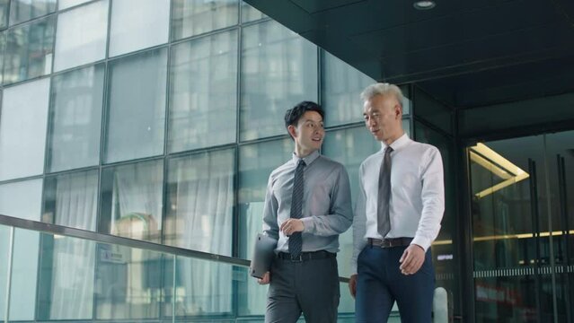 Confident business people walking in office building,4K