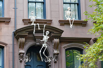 Entrance to old brownstone type apartment building, with Halloween decorations