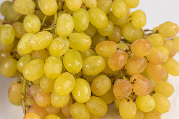 Ripe bunch of grapes on a white background. Isolate.