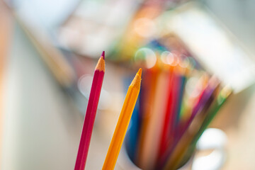 beautiful artistic abstract photography - colors and brushes and crayons in art studio - still life - shallow depth of field and artistic bokeh