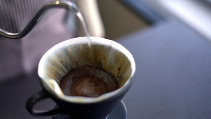 Close up barista making drip coffee.