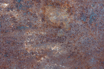 Grunge rusty metal background or texture with scratches and cracks, closeup, top view