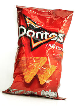 Red Doritos hot corn triangle shaped tortilla chips isolated on white background