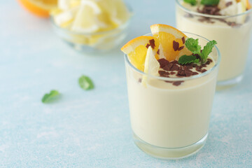 Orange lemon citrus milk mousse in glasses	