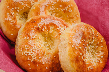 Uzbek bread with sesame seeds. Fresh bread tortillas on a plate.