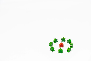 Red meeple is surrounded by green meeples. This can be concept of bully, encircle, odd, special and victim on white background.