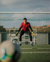 Vertical shoot of a goalkeeper in position ready for stop a shoot.