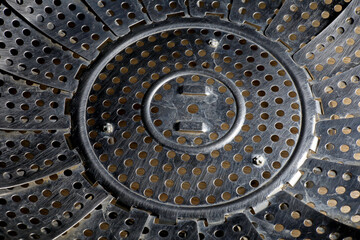 close-up detail of a perforated metal surface