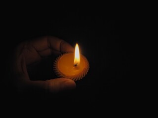 hand with candle