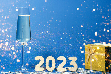 A glass of champagne and numbers of the year