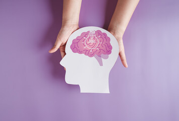 hands holding brain with light bulb paper cut, innovation idea creative, autism, Stroke, Epilepsy...