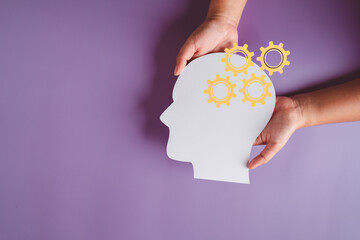 hands holding brain with setting icon paper cut, innovation idea creative, autism, Stroke, Epilepsy...