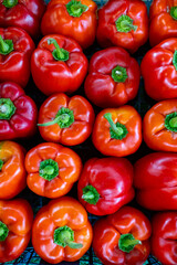 red bell peppers for sale at a market