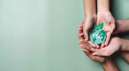 Hands holding growing tree on earth, ESG Environmental, environmental, social, and governance in...