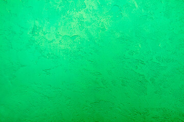 green background, decorative plaster on the wall