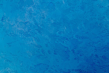 Blue background, texture of decorative plaster
