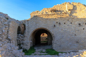 Fototapeta premium The walls of the castle ruins Kula Turnina near Rovij in Istria backlit at sunset