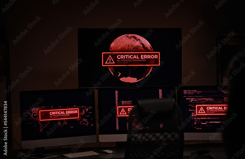 Poster Workplace of IT engineer or software developer in dark server room with group of computer screens showing critical error in working process