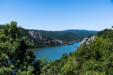 Obraz na płótnie Canvas Landscape of the Danube river (Danube gorges) seen from the Serbian shore. Dubova, Romania.