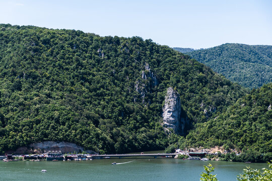 The Danube river and Decebal's head, seen from the Serbian shore. Dubova, Romania.