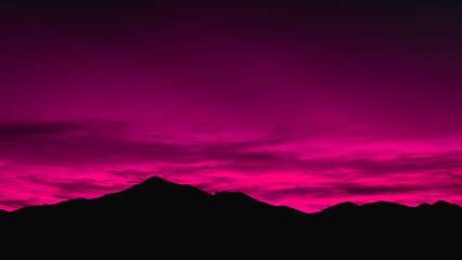 Dramatic Bold Pink Sunset Mountain Silhouette over the Mazatzal Peak in Tonto National Forest near Phoenix, Arizona