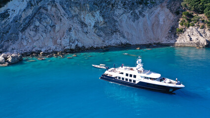 Aerial drone photo of large luxury yacht anchored in paradise Mediterranean bay with turquoise...