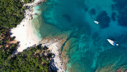 Aerial drone top down photo of tropical exotic paradise secluded rocky bay with deep turquoise sea...