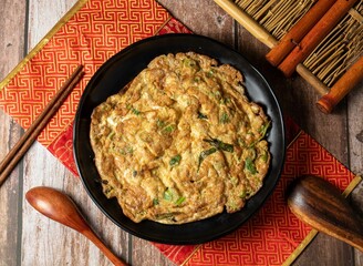 Baked Egg with Shrimp Paste and Scallion served in dish isolated on table side view of taiwan food
