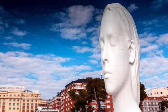 Modern sculpture titled Julia by Jaume Plensa Sune located at the Plaza de Colon in Madrid, Spain