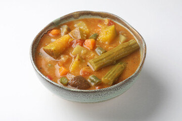 Sambar is a lentil-based vegetable stew soup, cooked with pigeon pea and tamarind broth. It is popular in South Indian and Sri Lankan cuisines.