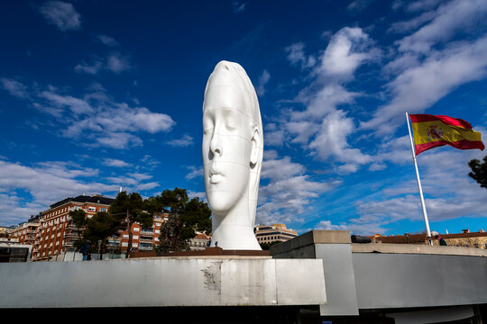 Modern sculpture titled Julia by Jaume Plensa Sune located at the Plaza de Colon in Madrid, Spain