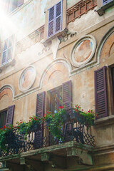 Sunlight hitting the balcony in one of the old buildings in Morcote, Ticino, Switzerland.