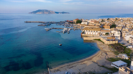 Aerial view at sunset on the island of Favignana. It's an Italian island belonging to the archipelago of the Aegadian islands, in Sicily, Italy. On background there is the Levanzo island.