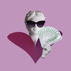 Antique female statue's head in black sunglasses holds a wad of hundred-dollar cash bills isolated...