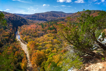 A scenic view of trees changing color and the Buffalo River in the Ozark Mountains