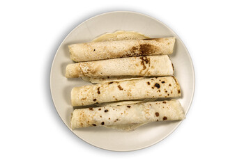 Pancakes on a cream colored plate isolated on transparent background