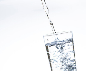 The image of pouring drinking water, into a glass,