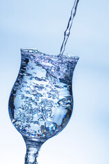 The image of pouring drinking water, into a glass,