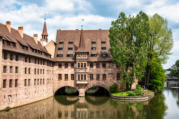 Hospice of the Holy Spirit, Heilig-Geist-Spital and Pegnitz river in Nuremberg, Germany