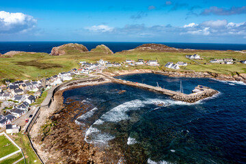 Aerial view of the settlement An Baile Thiar or West Town on Tory Island and harbour, County Donegal, Republic of Ireland © Lukassek