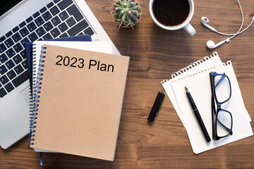 Note book with 2023 goals text on it to apply new year resolutions and plan.	