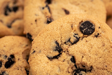 Cookies with chocolate chips close-up, food background.
