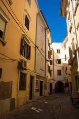 A quiet backstreet in the historic medieval centre of Piran on the coast of Slovenia
