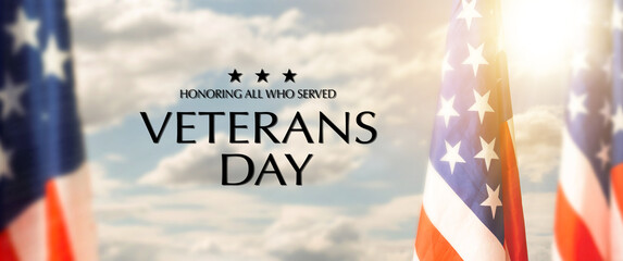 Closeup of American flag with Text Veterans Day Honoring All Who Served on textured background.