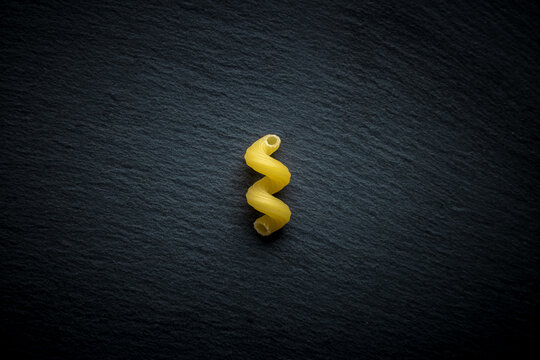 celentani pasta on dark slate. isolate